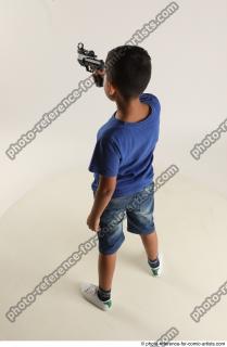 TIMBO STANDING POSE WITH GUN